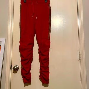 I am selling stacked sweat pants they are mainly red with gold on the sides.